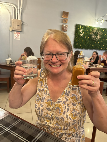 Mom drinking hot sauce infused water 