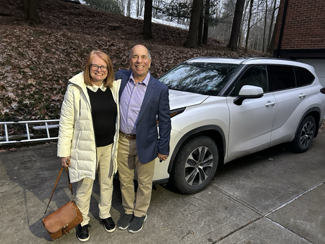 Tony and Cris in front of the work car.  